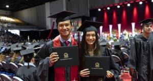 Graduates celebrating at University of Tampa commencement ceremony.