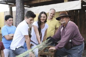 Family learning about traditional crafts at Florid.