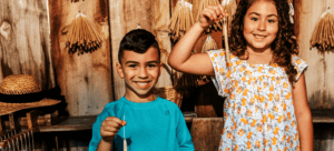 Children enjoying candle making on field trip